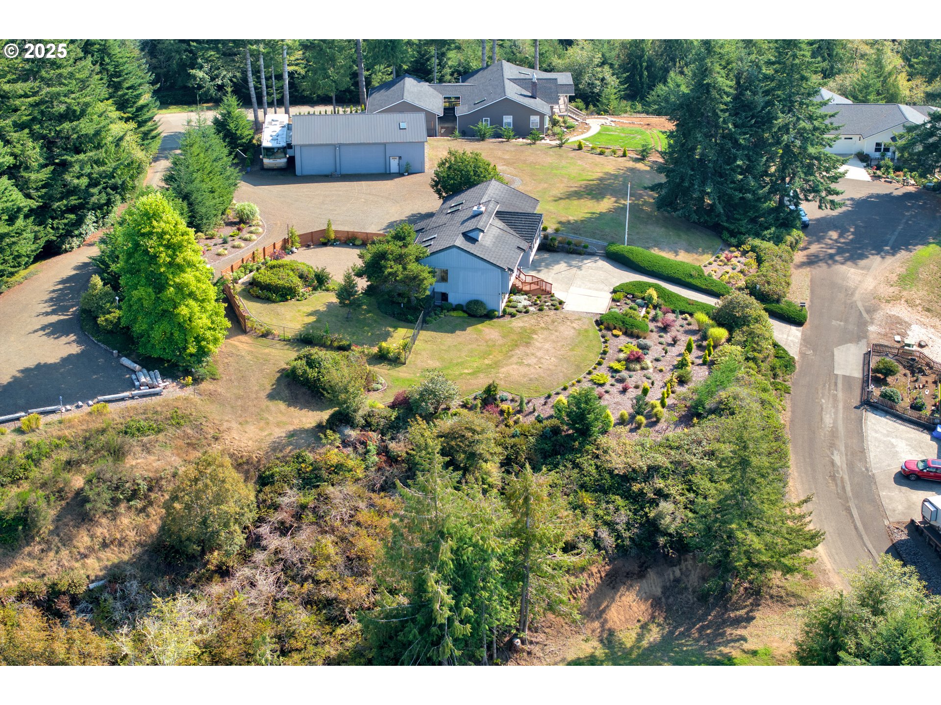 88616 Ocean View Lane Florence, OR 97439 - Photo 47 of 47 a view of a house with a yard and garden