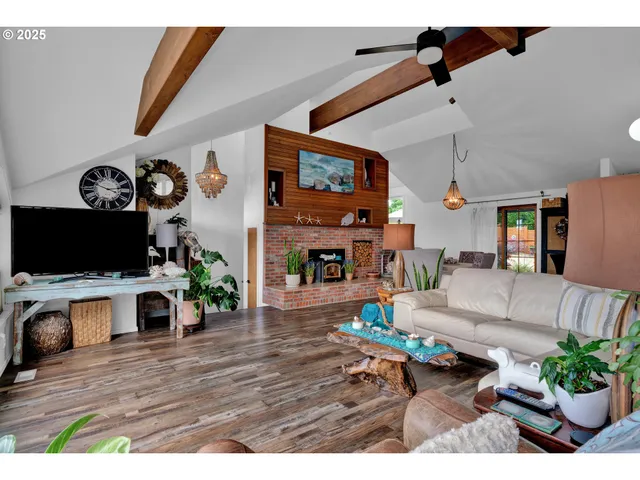a living room with furniture fireplace and flat screen tv