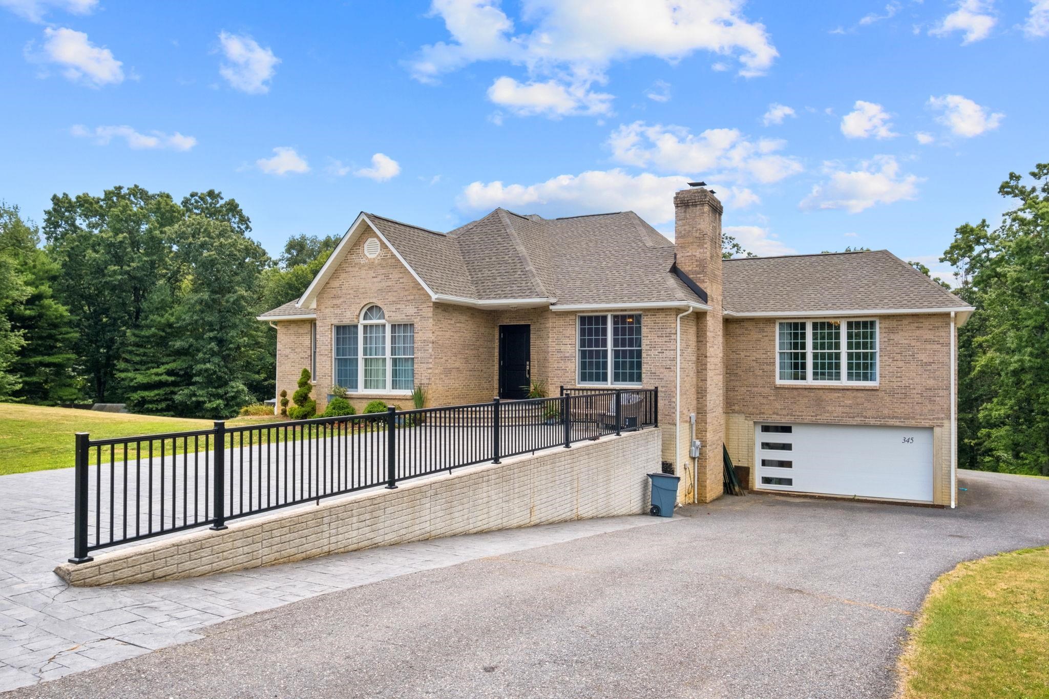 345 Enterprise Road Churchville, VA 24421 - Photo 2 of 49 a view of a house with a small yard and wooden fence