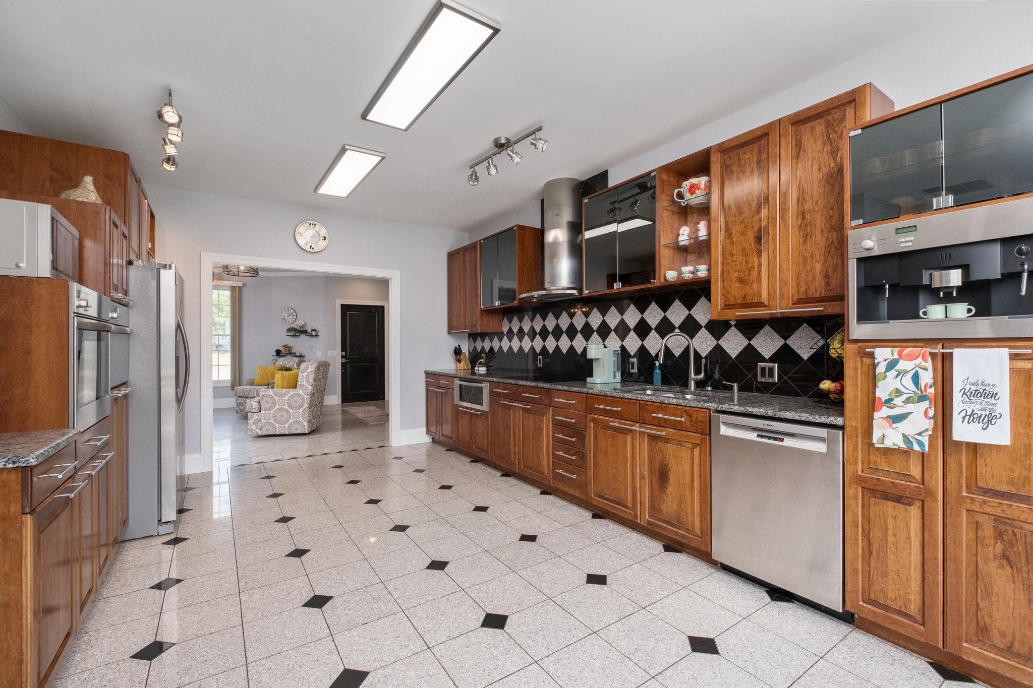 345 Enterprise Road Churchville, VA 24421 - Photo 9 of 49 a kitchen with stainless steel appliances a refrigerator sink and cabinets