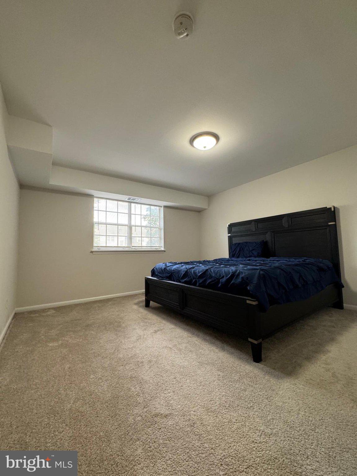 Cozy bedroom with natural light.