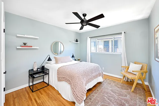 a bed room with a bed and a window