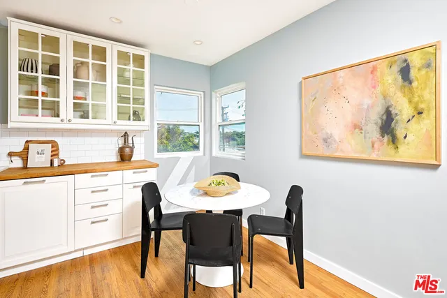 a view of a dining room with furniture and window