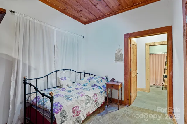 a bathroom with a toilet and a shower curtain
