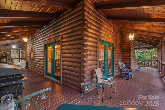a living room with fireplace furniture and a chandelier