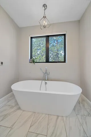 a white bath tub sitting in a bathroom