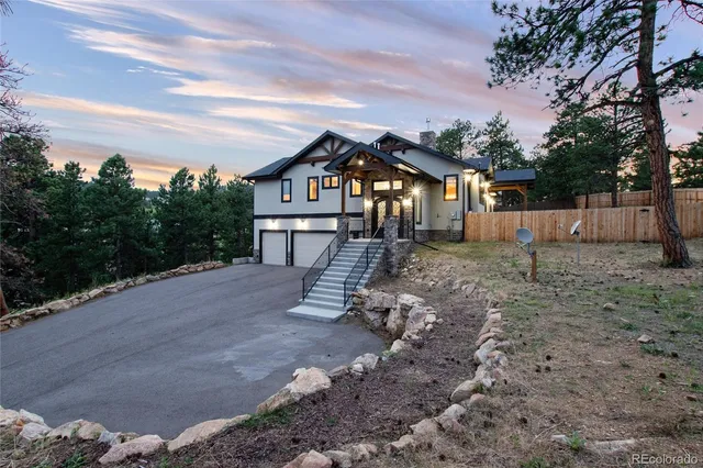 a view of a house with a yard porch and sitting area