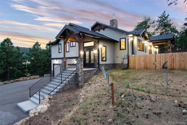 a front view of a house with garden