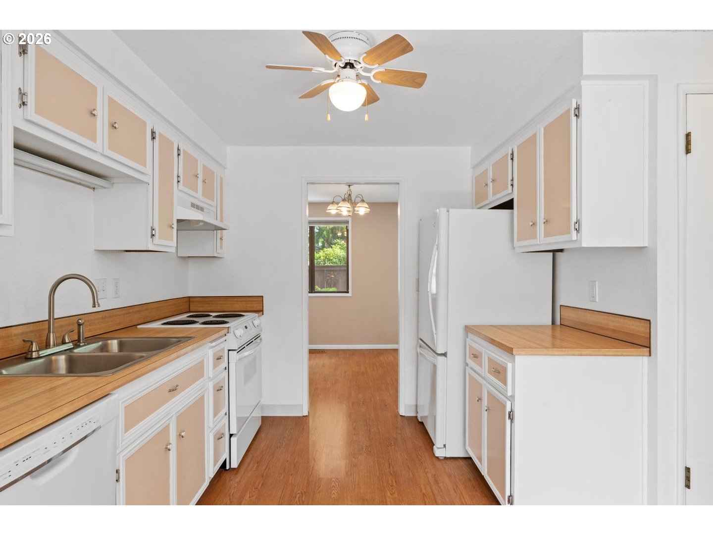 5792 Southwest 204th Place Beaverton, OR 97078 - Photo 11 of 33 a kitchen with stainless steel appliances granite countertop a sink stove and refrigerator