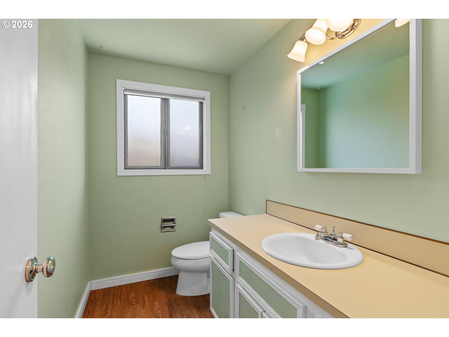 5792 Southwest 204th Place Beaverton, OR 97078 - Photo 15 of 33 a bathroom with a toilet sink and mirror