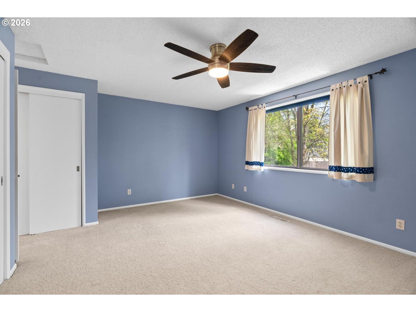 5792 Southwest 204th Place Beaverton, OR 97078 - Photo 17 of 33 a view of an empty room with a window