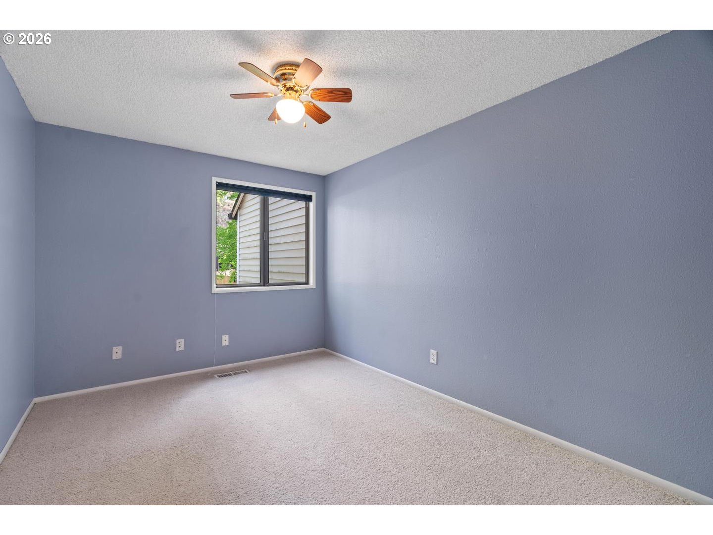 5792 Southwest 204th Place Beaverton, OR 97078 - Photo 20 of 33 a view of an empty room with a window