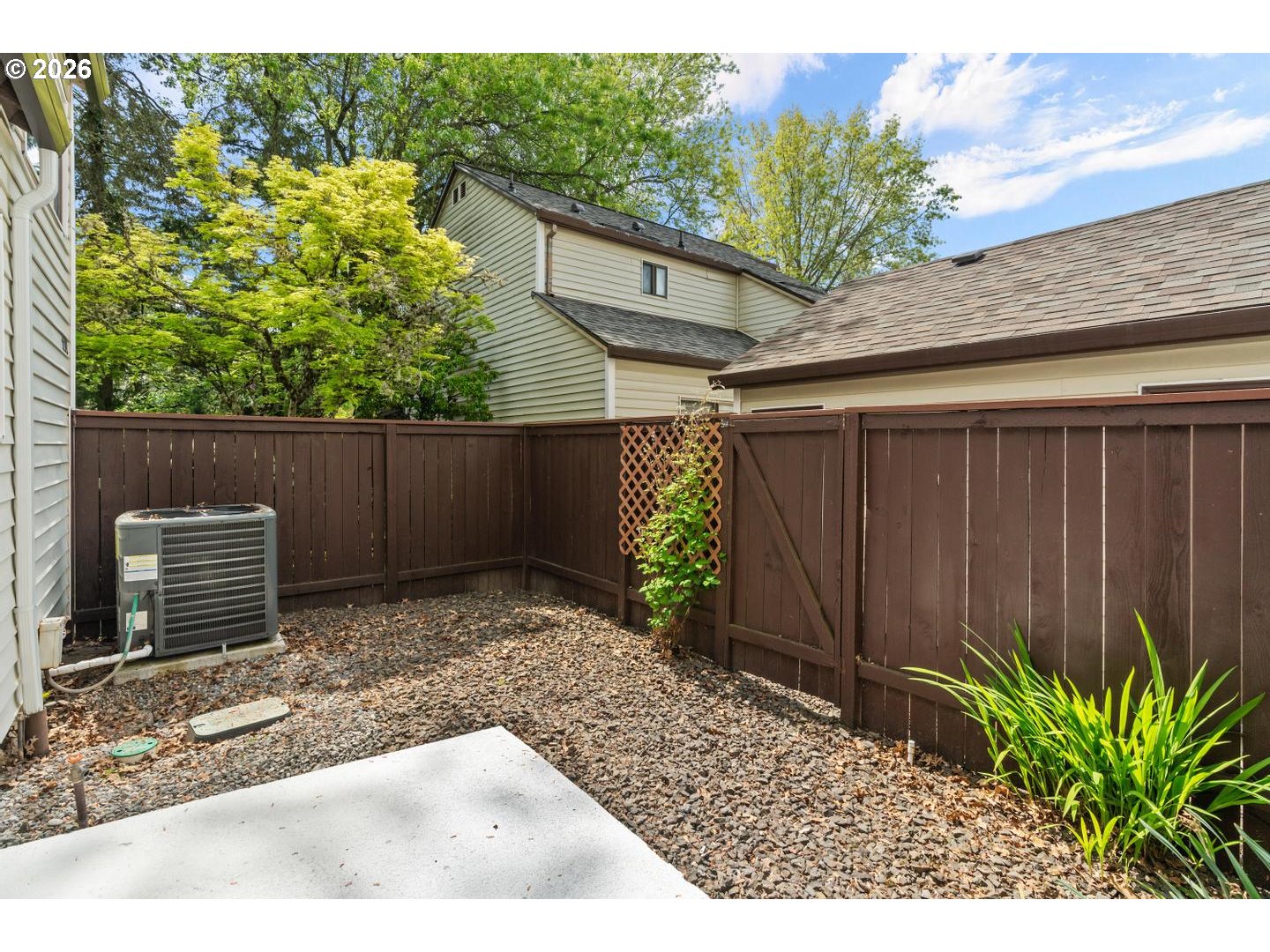 5792 Southwest 204th Place Beaverton, OR 97078 - Photo 25 of 33 a backyard of a house with a tree