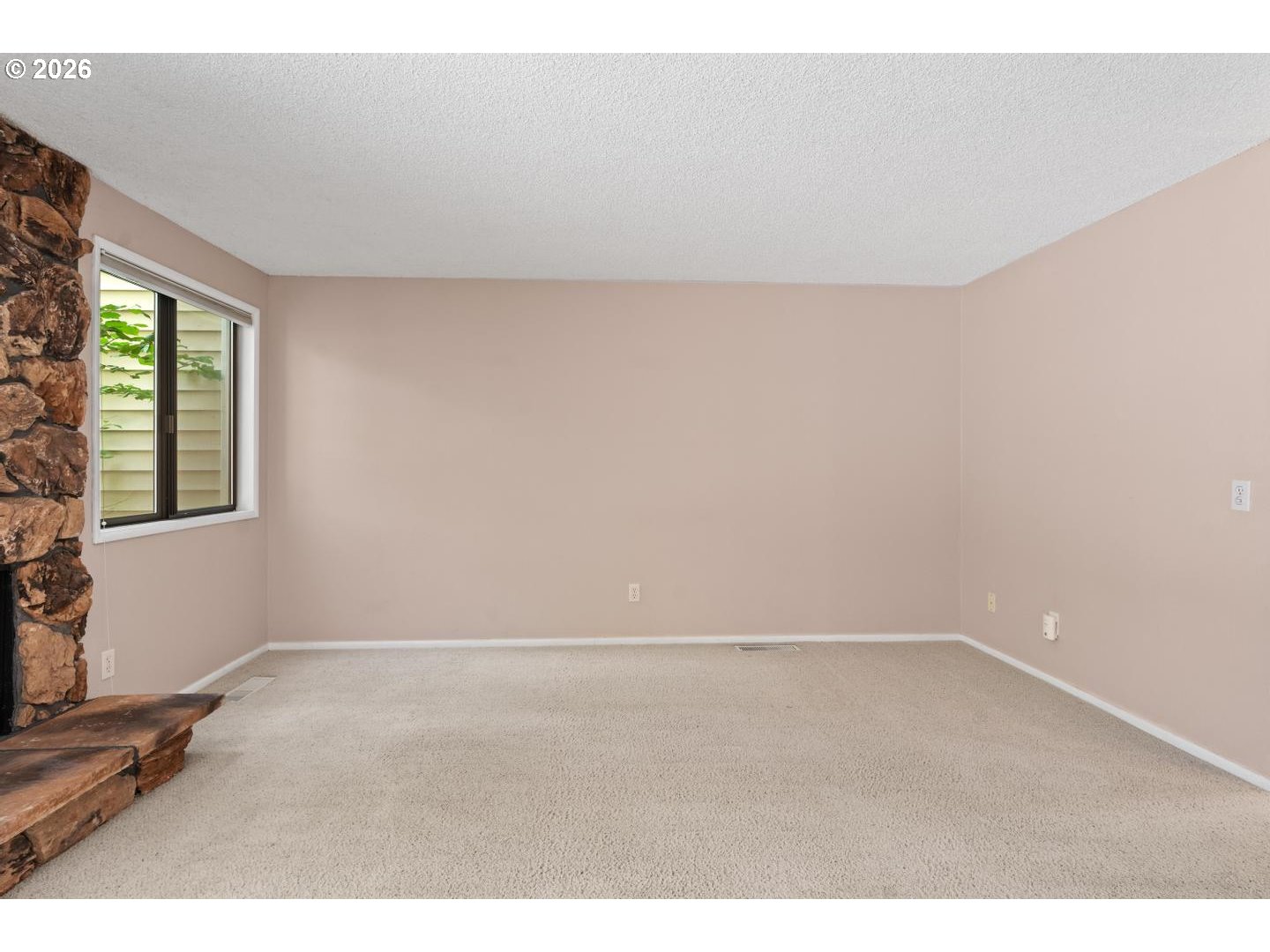 5792 Southwest 204th Place Beaverton, OR 97078 - Photo 5 of 33 a view of an empty room with a window