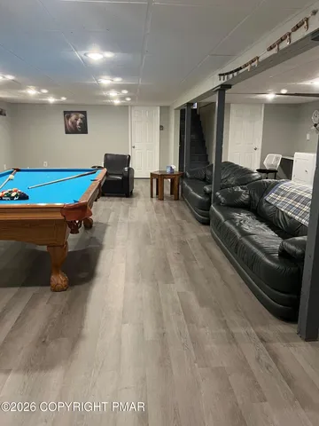 a room with furniture and a mirror