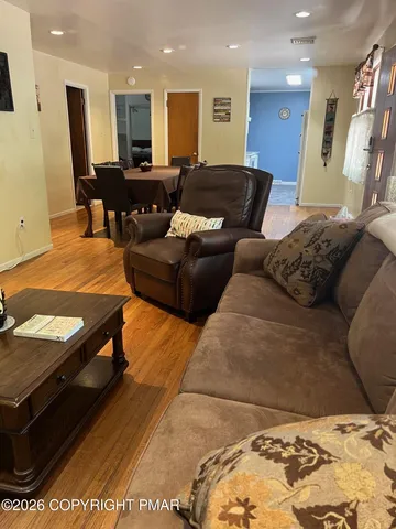 a living room with furniture and a rug