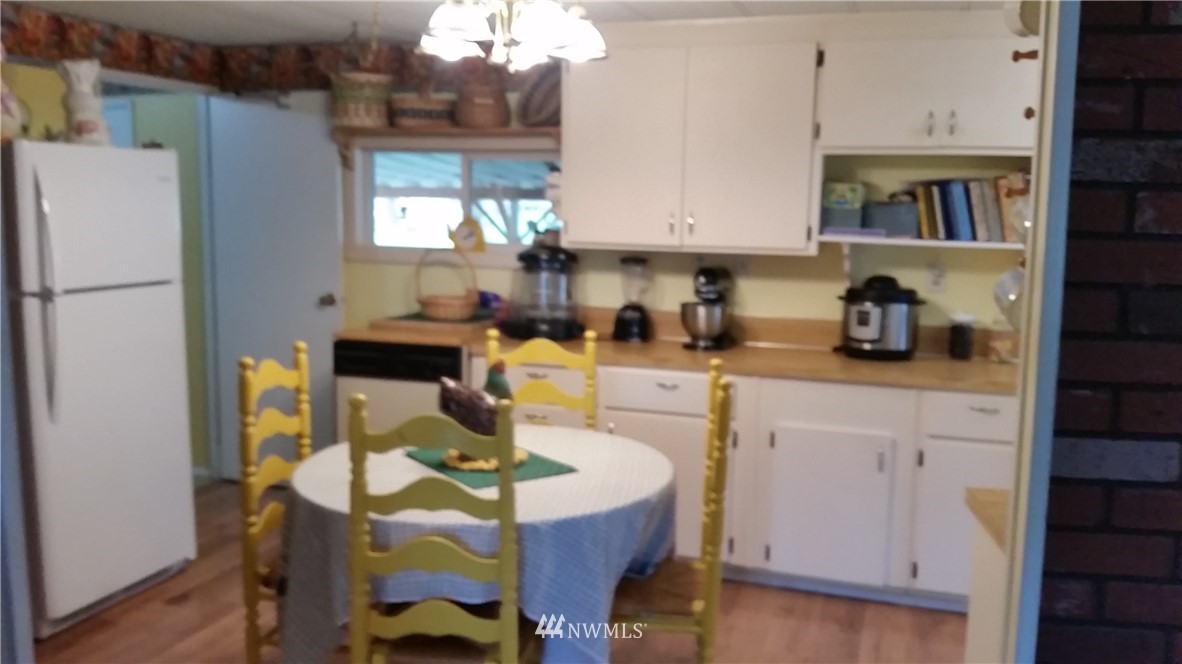 224 Wirta Road Winlock, WA 98596 - Photo 7 of 22 a kitchen with a sink a stove a refrigerator and cabinets