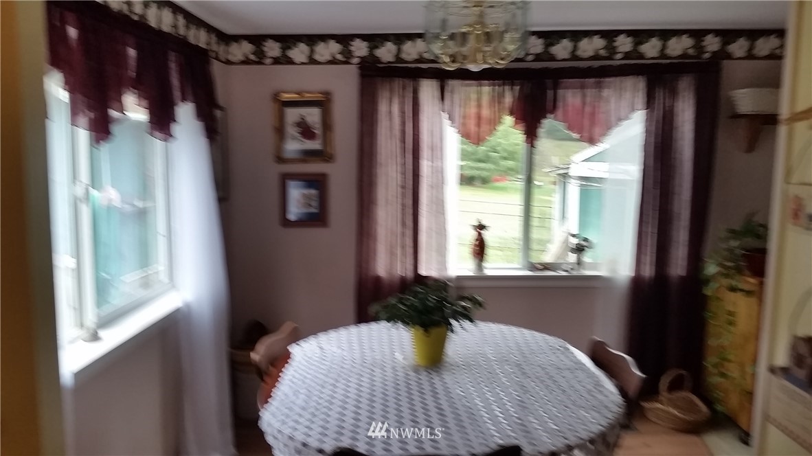 224 Wirta Road Winlock, WA 98596 - Photo 8 of 22 a bed sitting in a bedroom next to a window