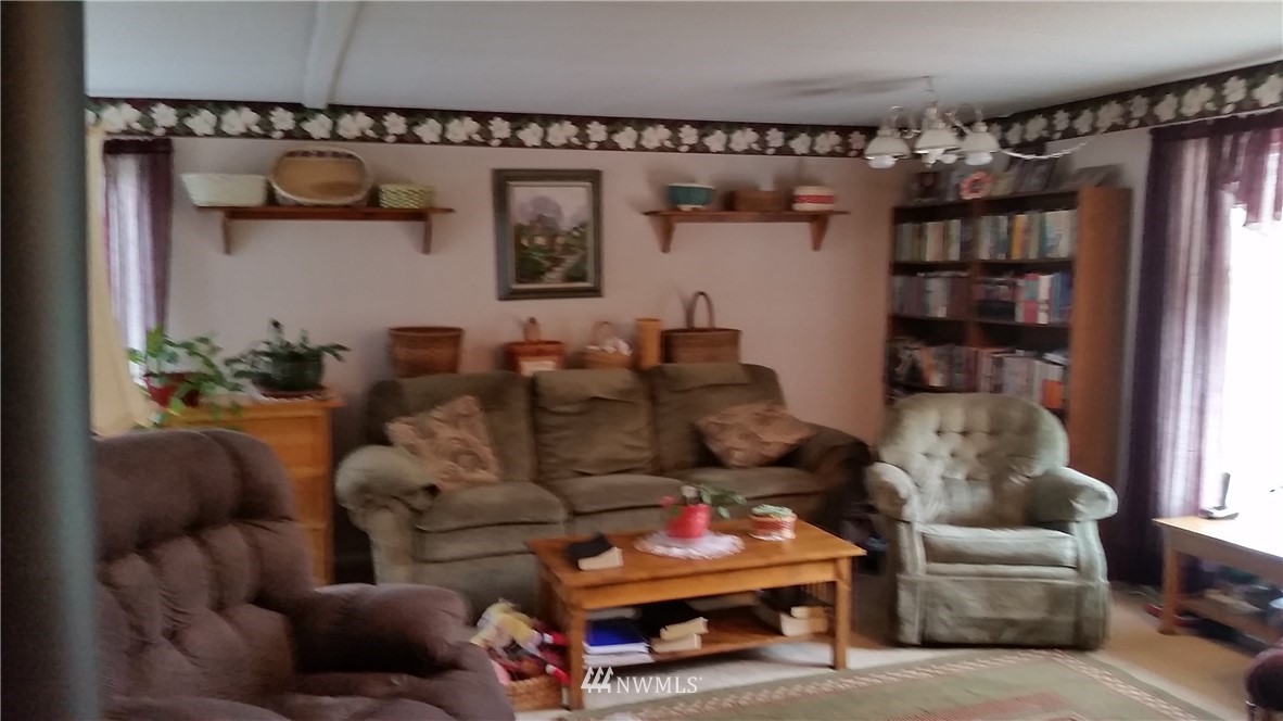 224 Wirta Road Winlock, WA 98596 - Photo 9 of 22 a living room with furniture and a book shelf