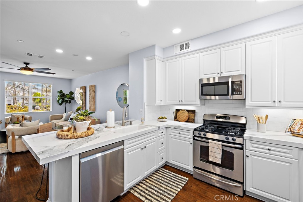 23 Aliso Ridge Loop Mission Viejo, CA 92691 - Photo 36 of 65 Beautiful countertops and new backsplash