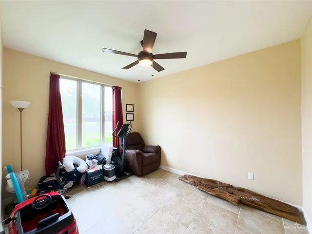 a room with gym equipment and a large window
