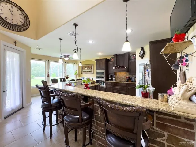 a kitchen with a table and chairs in it