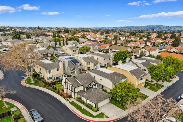 an aerial view of residential houses with outdoor space
