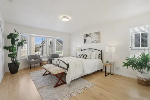 a bedroom with bed and a window