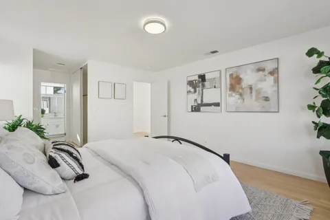 a view of a patio with couches table and chairs and potted plants