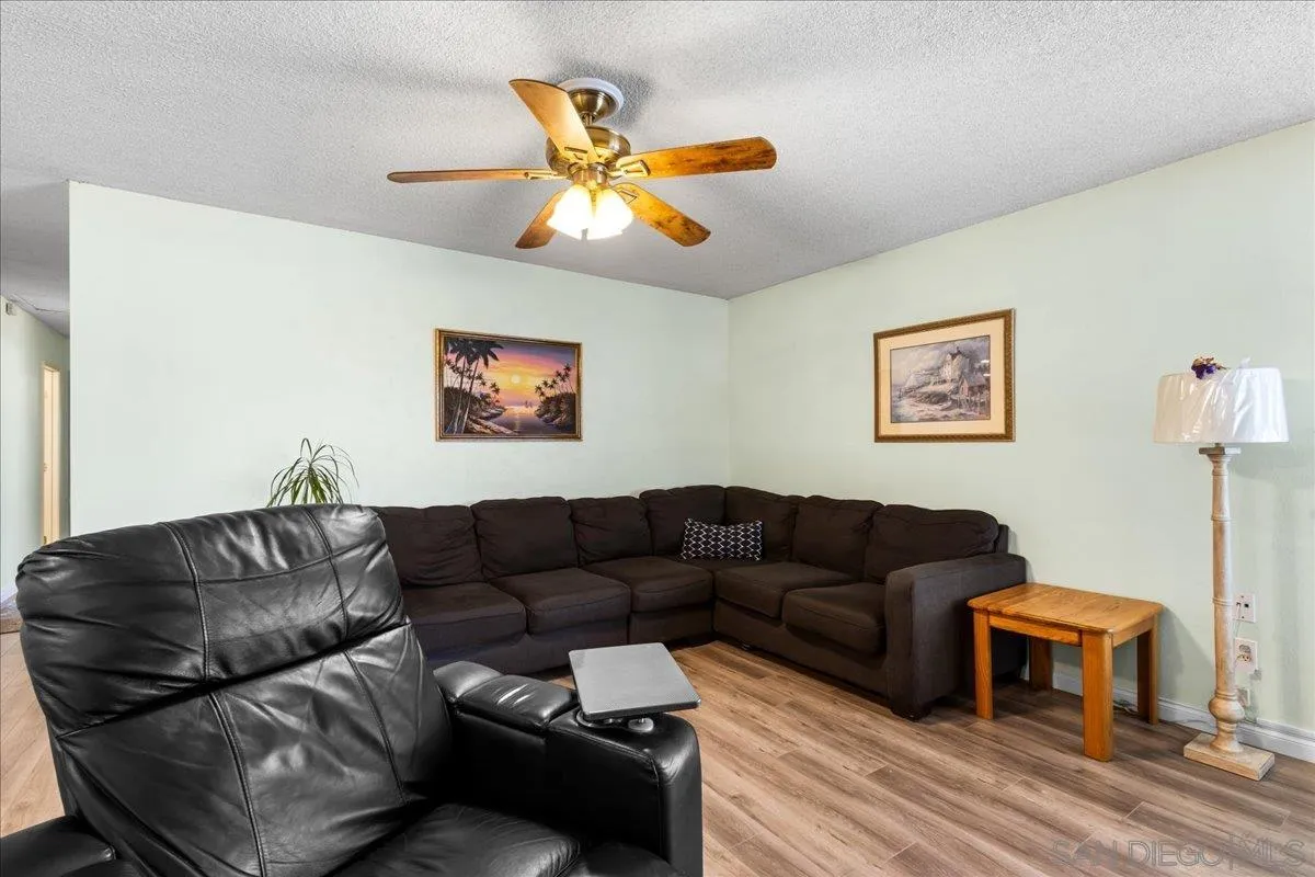 10738 2nd Street Santee, CA 92071 - Photo 5 of 52 a living room with furniture a couch and a ceiling fan