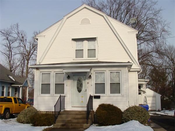 19 Strong Street Springfield, MA 01104 - Photo 1 of 11 a view of a white house with large windows