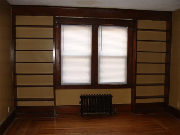 19 Strong Street Springfield, MA 01104 - Photo 5 of 11 a room with a window and wooden floor