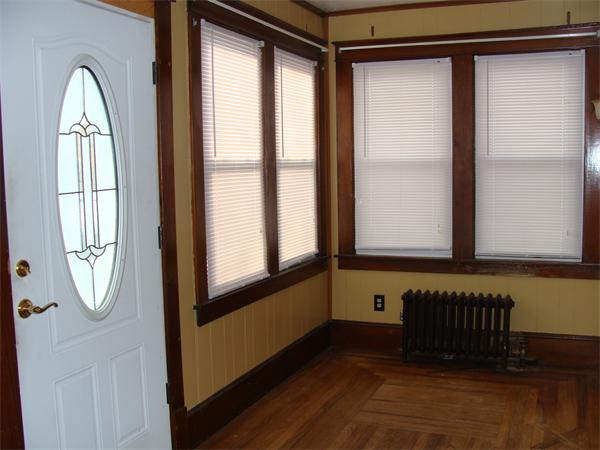 19 Strong Street Springfield, MA 01104 - Photo 7 of 11 a view of an entryway with wooden floor and door