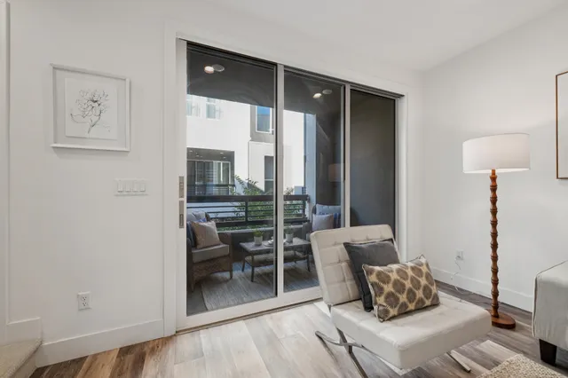 a bedroom with furniture and a chandelier