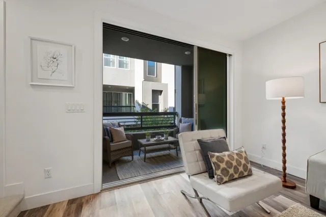 a living room with furniture and a lamp