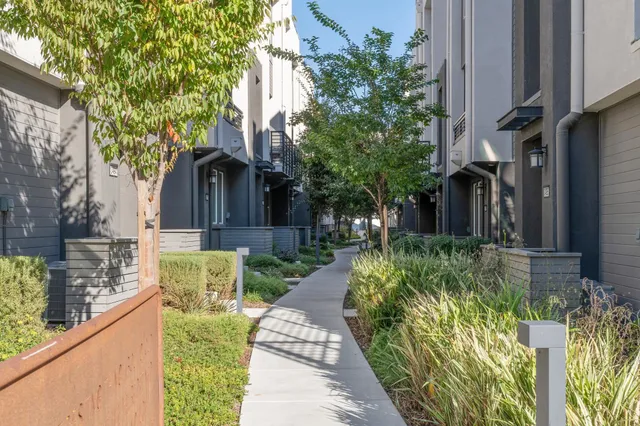 a front view of house and yard with green space