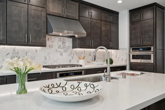 a kitchen with a table and chairs