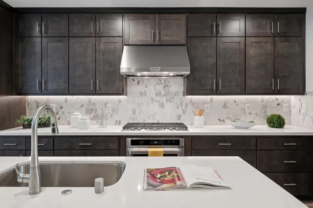 a kitchen with a sink and cabinets