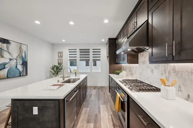 a kitchen with a sink and stove