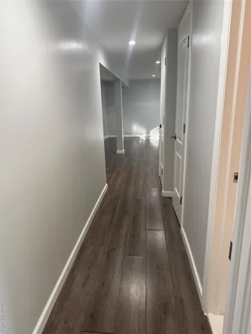 a view of gallery with wooden floor