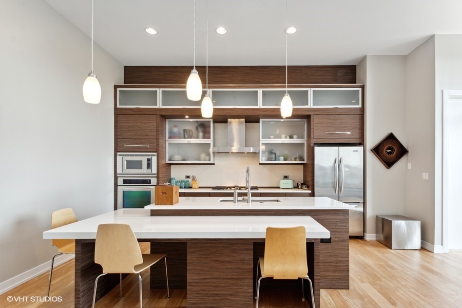 2408 West Rice Street, Unit 403 Chicago, IL 60622 - Photo 5 of 19 a kitchen with a table and chairs in it