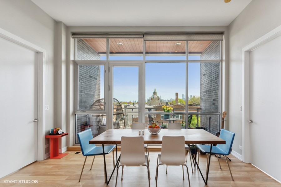 2408 West Rice Street, Unit 403 Chicago, IL 60622 - Photo 8 of 19 a dining room with furniture and window