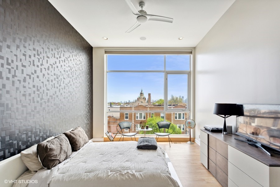 2408 West Rice Street, Unit 403 Chicago, IL 60622 - Photo 10 of 19 a living room with furniture and a large window