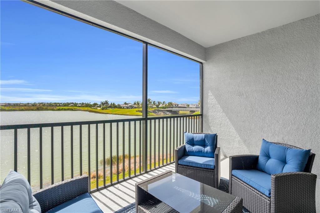 11761 Venetian Lagoon Drive, Unit 204 Fort Myers, FL 33913 - Photo 19 of 46 Sunroom / solarium featuring outdoor lounge area and a water view