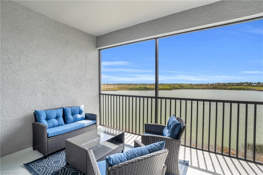 11761 Venetian Lagoon Drive, Unit 204 Fort Myers, FL 33913 - Photo 20 of 46 Sunroom / solarium with a water view