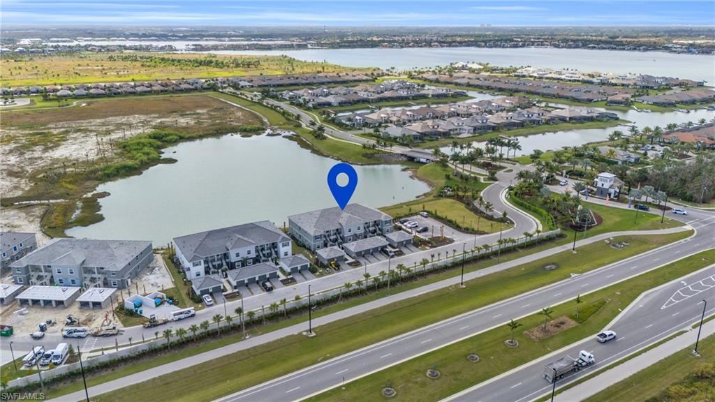11761 Venetian Lagoon Drive, Unit 204 Fort Myers, FL 33913 - Photo 22 of 46 Aerial view featuring a water view and a residential view