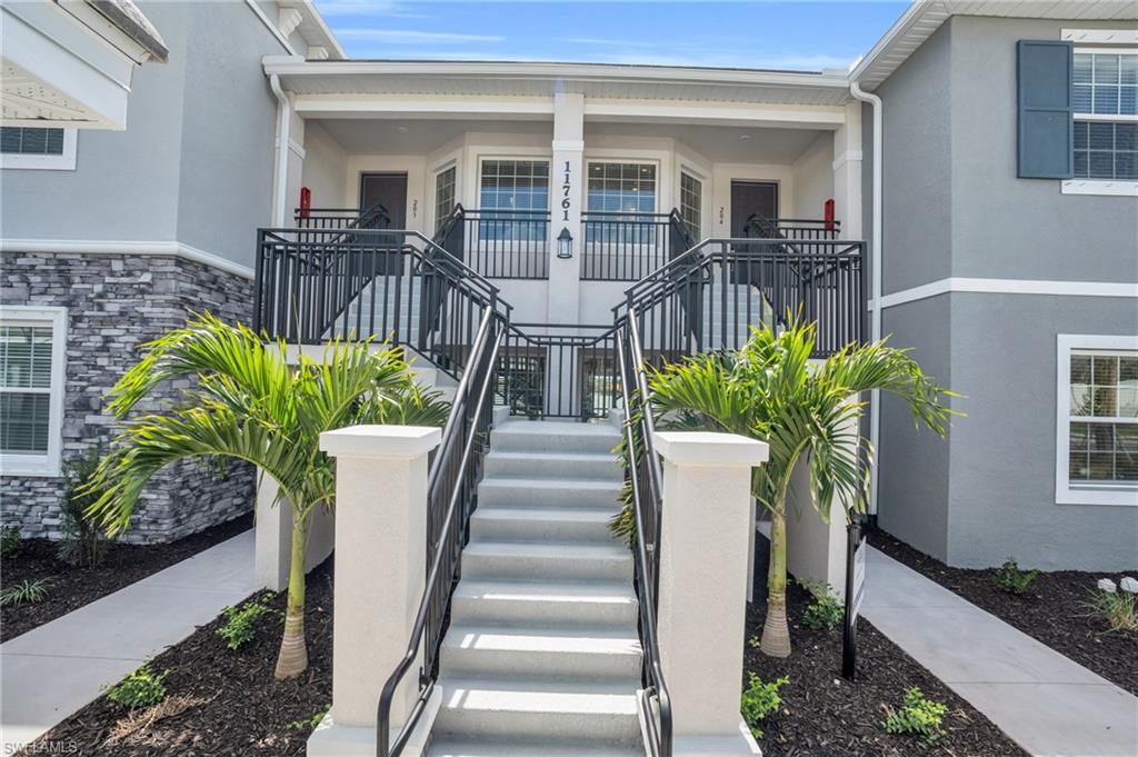 11761 Venetian Lagoon Drive, Unit 204 Fort Myers, FL 33913 - Photo 24 of 46 Property entrance with stucco siding, stone siding, and covered porch