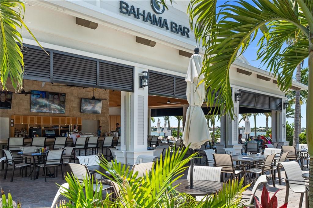 11761 Venetian Lagoon Drive, Unit 204 Fort Myers, FL 33913 - Photo 33 of 46 View of patio with outdoor dining area