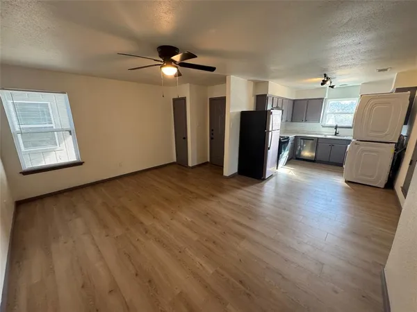 a view of an empty room with a window