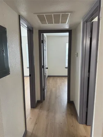 a view of a storage and utility room with washer and dryer